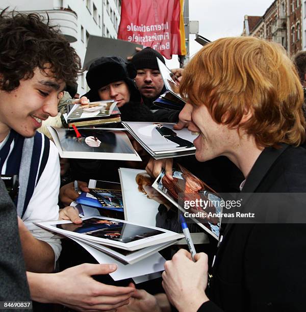 Actors Robert Sheehan and Rupert Grint sign autographs prior to the photocall for 'Cherrybomb' as part of the 59th Berlin Film Festival at the...