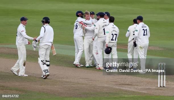 Essex Simon Harmer is congratulated after taking the final Warwickshire wicket during the Specsavers County Championship match at Edgbaston,...