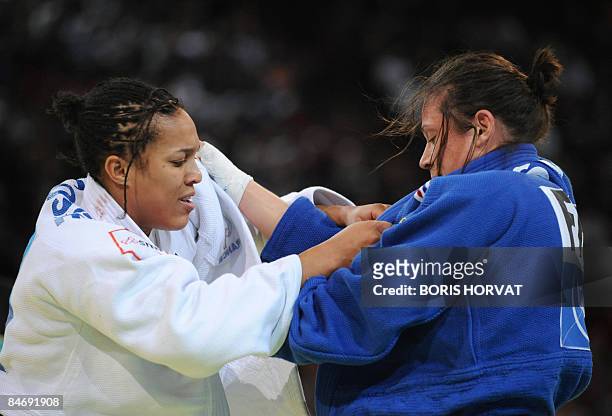 French Lucie Decosse battles with French Marie Pasquet on February 8 during their women final round in the -70 kg category at the Paris judo...