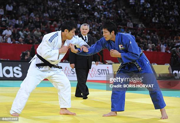 Korean Dae-Nam Song battles with Korean Jae-Bum Kim, on February 8 during their men final round in the -81 kg category at the Paris judo tournament,...
