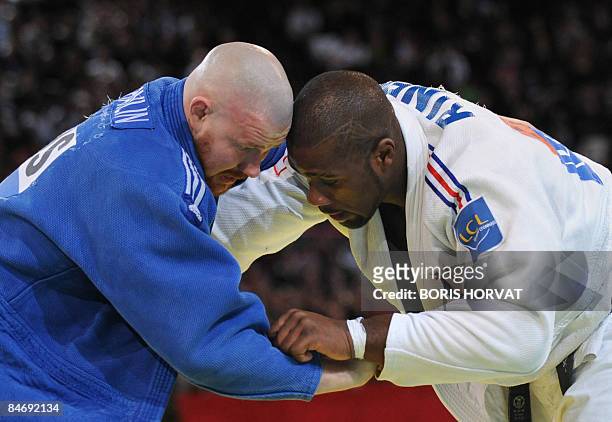 French Teddy Riner battles with Russian Alexander Mikhaylin on February 8, 2009 during their men final round in the +110 kg category, at the Paris...