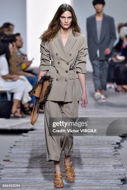 Model walks the runway at the Michael Kors Ready to Wear Spring/Summer 2018 fashion show during New York Fashion Week on September 13, 2017 in New...