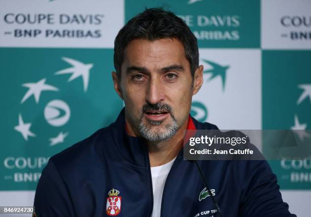 Nenad Zimonjic of Serbia answers to the media following the draw of the Davis Cup World Group semi-final between France and Serbia at Stade Pierre...