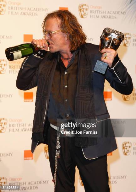 Best Actor Mickey Rourke poses at the winner's board at The Orange British Academy Film Awards held at the Royal Opera House on February 8, 2009 in...