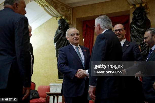 Special Representative Ghassan Salame, center left, from Lebanon shakes hands with U.S. Secretary of State Rex Tillerson, watched by from left,...