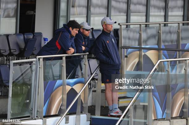 Alastair Cook of Essex talks to Ian Bell and Jonathan Trott of Warwickshire during the County Championship Division One match between Warwickshire...