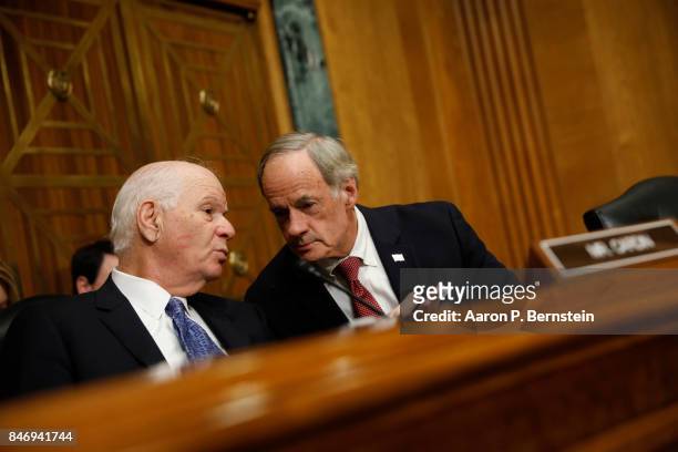 Sen. Ben Cardin speaks with Sen. Tom Carper during a tax reform hearing before the Senate Finance Committee on Capitol Hill September 14, 2017 in...