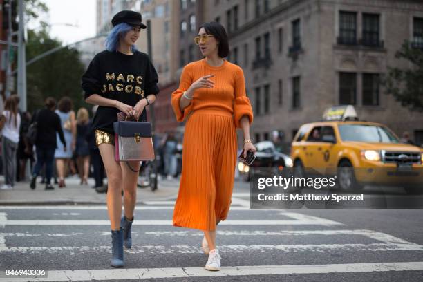 Irene Kim & Eva Chen are seen attending Marc Jacobs during New York Fashion Week wearing Marc Jacobs, Ksenia Schnaider, adidas Originals on September...