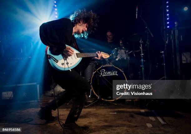 The Blinders with Thomas Haywood on guitar and vocals, Charlie McGough on bass and Matt Neale on drums perform on the House Party stage at Kendal...