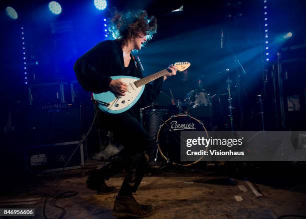 The Blinders with Thomas Haywood on guitar and vocals, Charlie McGough on bass and Matt Neale on drums perform on the House Party stage at Kendal...