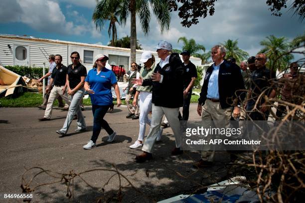 President Donald Trump and Vice President Mike Pence tour the Naples Estates neighborhood damaged by Hurricane Irma on September 14, 2017 in Naples,...