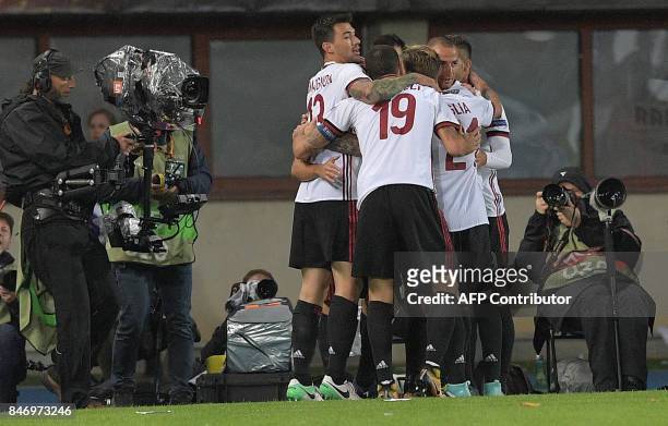Milan's players celebrate after they scored to 1-0 goal during the UEFA Europa League group D football match FK Austria Wien v AC Milan in Vienna,...