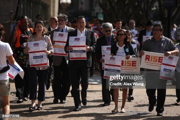 People participate in a immigration march to the White House September 14, 2017 in Washington, DC. The National Hispanic Leadership Agenda held a...