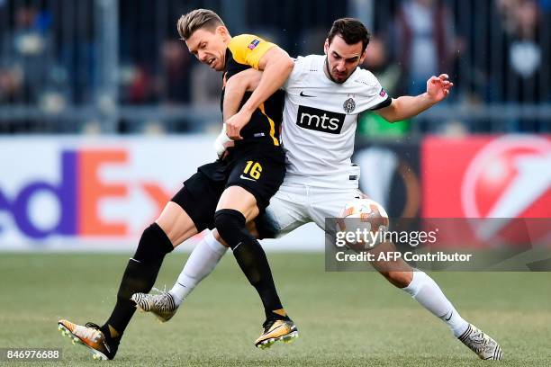 Young Boys' Christian Fassnacht vies for the ball with Partizan's Marko Jankovic during the UEFA Europa League Group B football match beetween BSC...