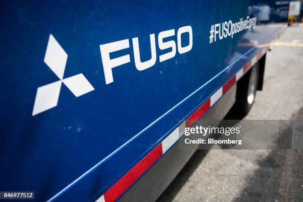 The Mitsubishi Fuso Truck & Bus Corp. Logo is seen on the side of the company's new eCanter truck during a launch event in New York, U.S., on...