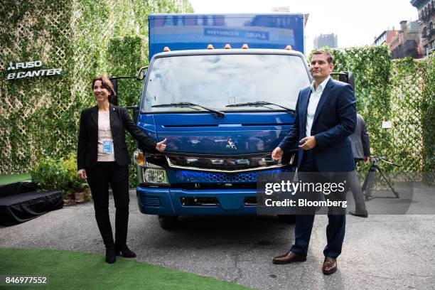 Marc Llistosella, chief executive officer of Mitsubishi Fuso Truck and Bus Corp., right, and Jecka Glasman, chief executive officer of Mitsubishi...