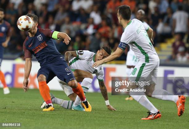 Emre Belozoglu of Medipol Basaksehir in action against Abel Anicet of Ludogorets during the UEFA Europa League Group C soccer match between Medipol...