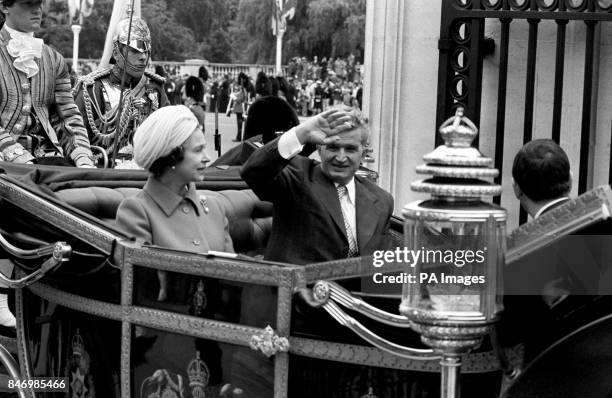 Queen Elizabeth II with President Nicolae Ceausescu of Romania during the ceremonial drive from Victoria Station to Buckingham Palace. It is the...