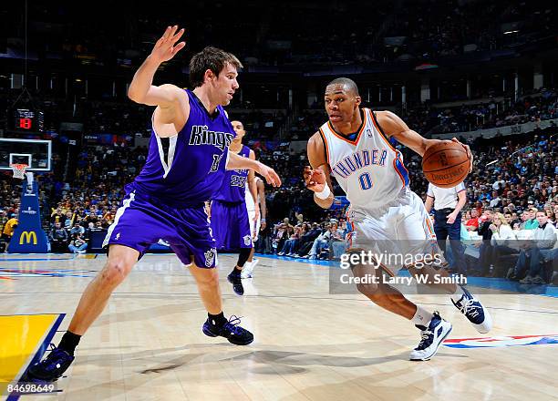 Russell Westbrook of the Oklahoma City Thunder goes to the basket against Beno Udrih of the Sacramento Kings at the Ford Center on February 8, 2009...