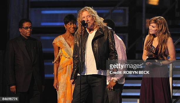 Robert Plant and Alison Krauss receive the Record of the Year award from Herbie Hancock and Natalie Cole during the 51st annual Grammy awards held at...