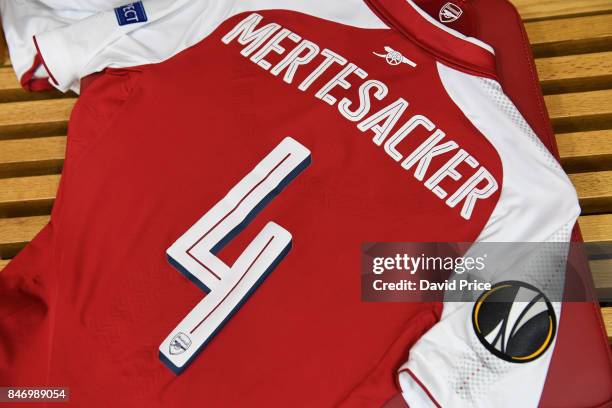 Per Mertesacker's Arsenal shirt and pennant in the changingroom before the UEFA Europa League group H match between Arsenal FC and 1. FC Koeln at...