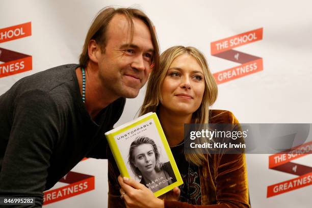Michael Trainer poses for a picture with Maria Sharapova after having her sign a copy of her book at the Summit of Greatness on September 14, 2017 in...