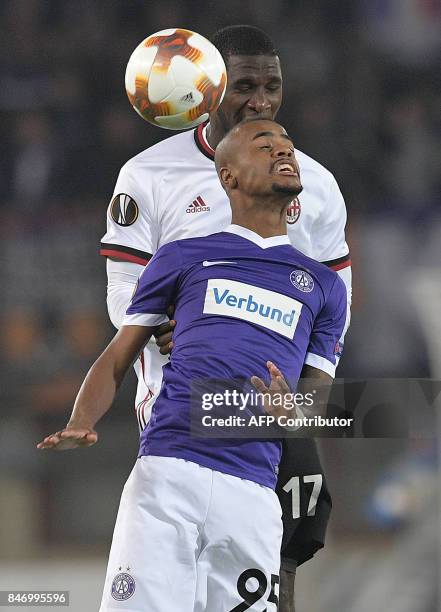 Austria Wien's forward from Brazil Felipe Pires and AC Milan's defender from Colombia Cristian Zapata vie for the ball during the UEFA Europa League...