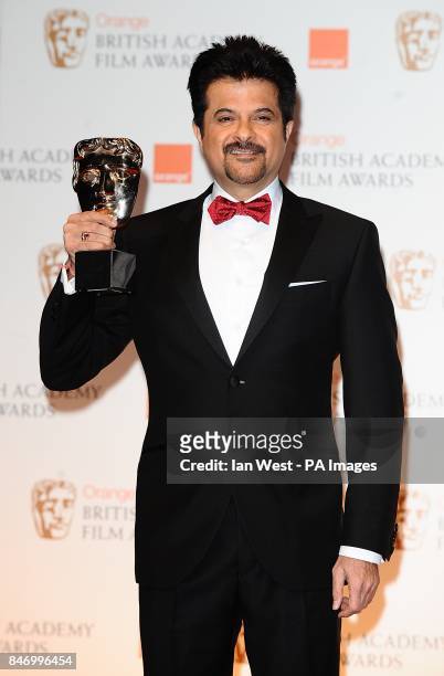 Anil Kapoor collects the award for Film Not in the English Language on behalf of The Skin I Live In, in the press room at the 2012 Orange British...
