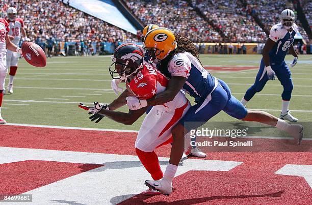 Wide receiver Brandon Marshall of the AFC All-Stars Denver Broncos tries to catch an end zone pass broken up by cornerback Al Harris of the the NFC...