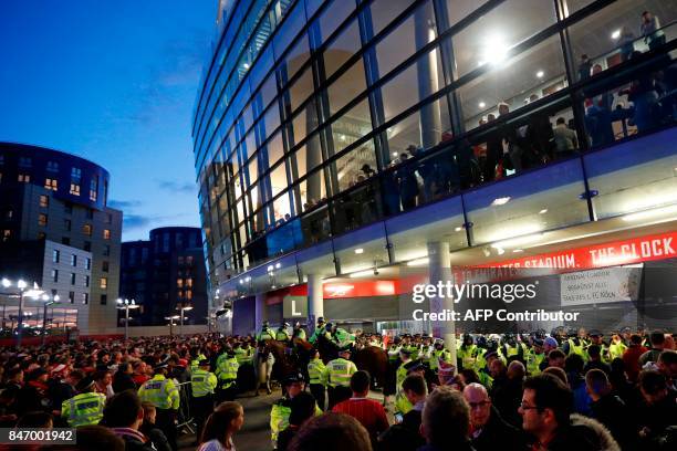 Police guard the stadium entrances as the kick off is delayed due to crowd safety issues ahead of the UEFA Europa League Group H football match...