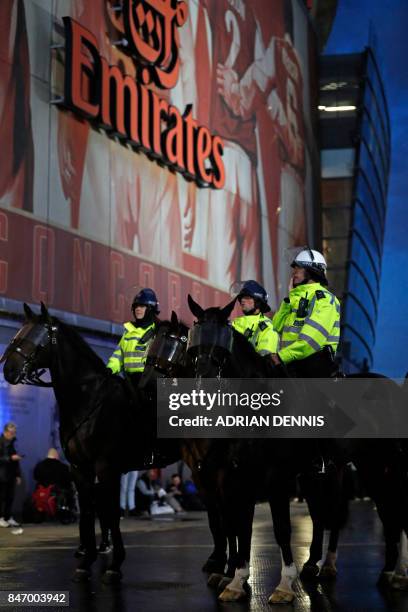 Mounted police guard the stadium entrances as the kick off is delayed due to crowd safety issues ahead of the UEFA Europa League Group H football...