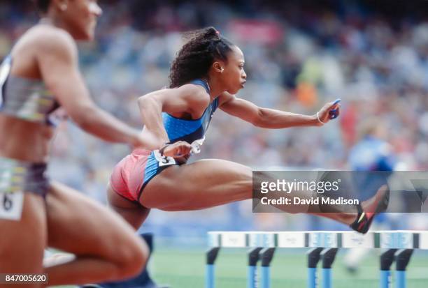 Gail Devers of the USA competes in the first round of the Women's 100 meter hurdles event of the 2000 Summer Olympics track and field competition on...