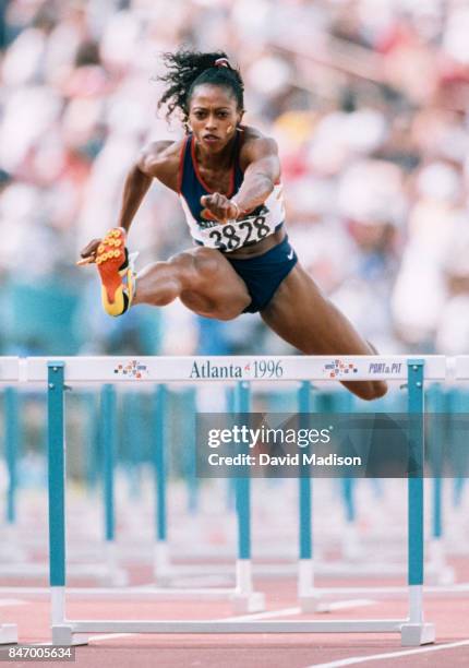 Gail Devers of the USA runs in a heat of the 100 meter hurdles event of 1996 Summer Olympics on July 29, 1996 in the Centennial Olympic Stadium in...