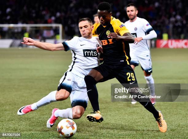 Young Boys' Jordan Lotomba vies for the ball with Partizan's Miroslav Vulicevic during the UEFA Europa League group stage football match between BSC...