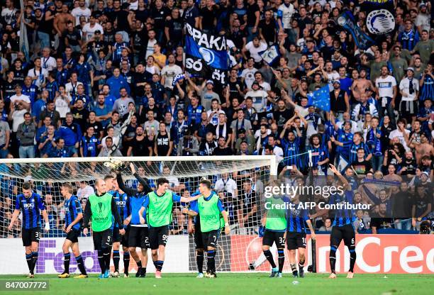 Atalanta's players celebrate after winning the UEFA Europa League match Atalanta vs Everton at the Mapei Stadium in Reggie Emilia on September 14,...