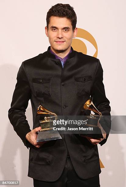 Musician John Mayer, winner of two awards, Best Male Pop Vocal Performance for "Say" and Best Solo Rock Vocal Performance for "Gravity" poses in the...