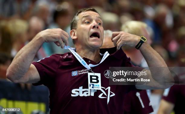 Alfred Gislason, head coach of Kiel reacts during the DKB HBL Bundesliga match between THW Kiel and DHfK Leiipzig at Sparkassen Arena on September...
