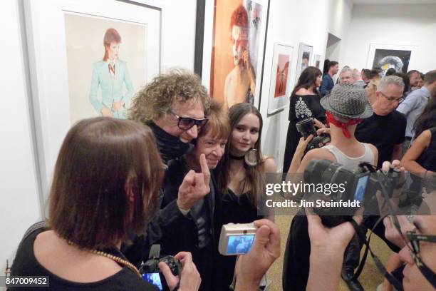 Photographer Mick Rock with DJ Rodney Bingenheimer, and Kansas Bowling at the Mick Rock photo exhibit at the Taschen Gallery in Los Angeles,...