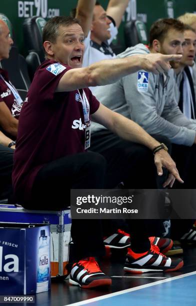 Alfred Gislason, head coach of Kiel gestures during the DKB HBL Bundesliga match between THW Kiel and DHfK Leiipzig at Sparkassen Arena on September...