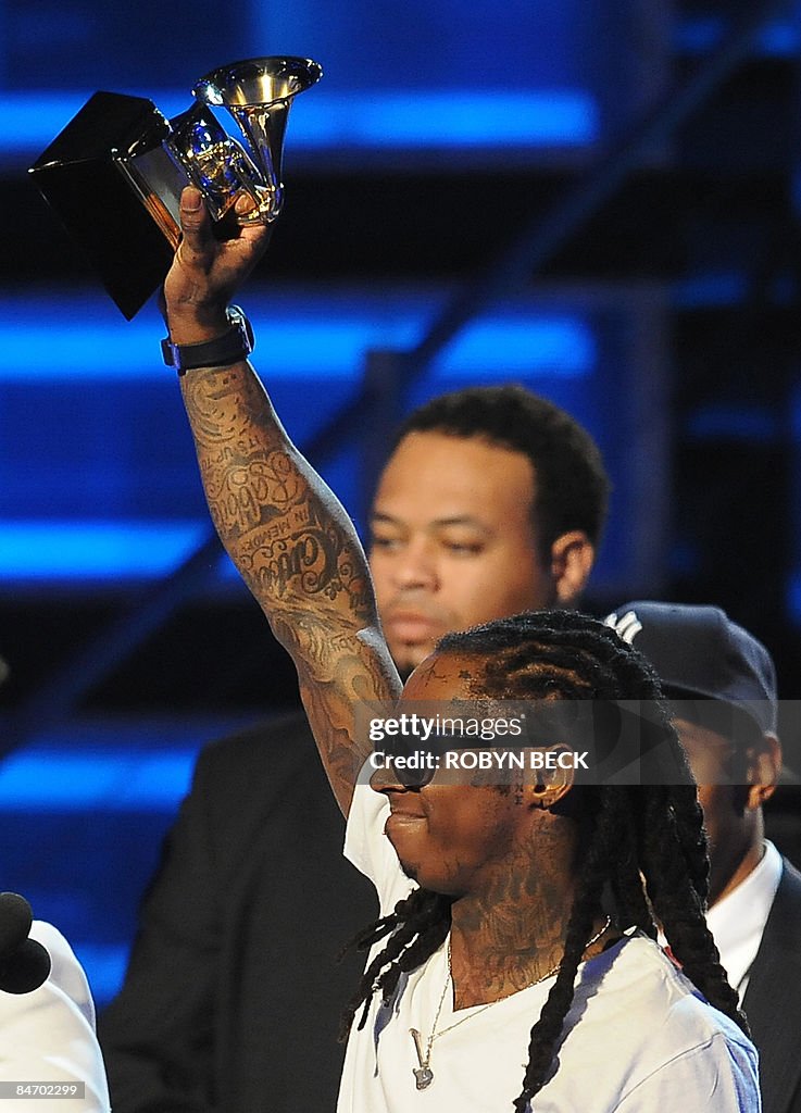 Lin Wayne Rapper Rapper Lil Wayne accepts the Best Rap Solo Performance award during ...