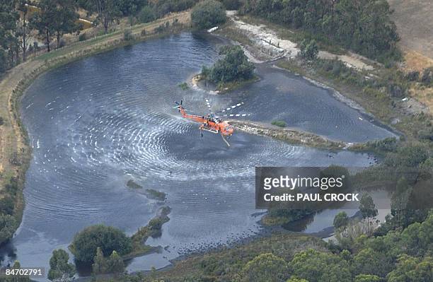 An aircrane fire-fighting aircraft collects a load of water to fight the Bunyip Ridge wildfire, some 100km east of Melbourne on February 9, 2009....
