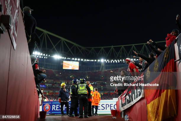Koeln fans are monitored by police during the UEFA Europa League group H match between Arsenal FC and 1. FC Koeln at Emirates Stadium on September...