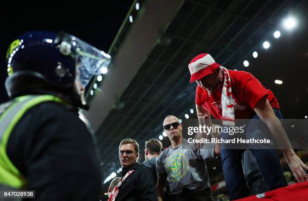 Koeln fans are monitored by police during the UEFA Europa League group H match between Arsenal FC and 1. FC Koeln at Emirates Stadium on September...