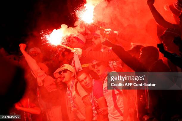 Cologne fans light flares inside the stadium during the UEFA Europa League Group H football match between Arsenal and FC Cologne at The Emirates...