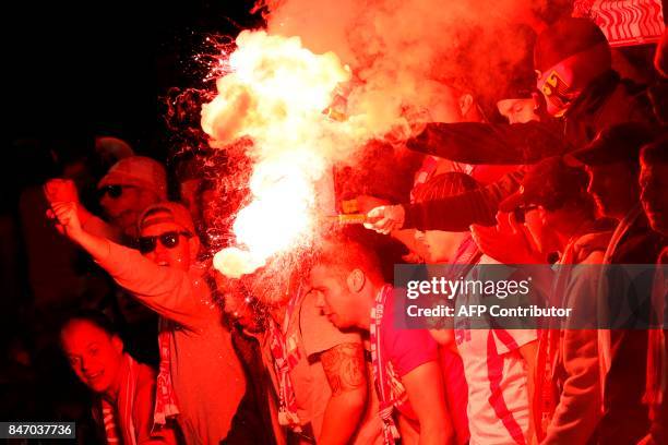 Cologne fans light flares inside the stadium during the UEFA Europa League Group H football match between Arsenal and FC Cologne at The Emirates...