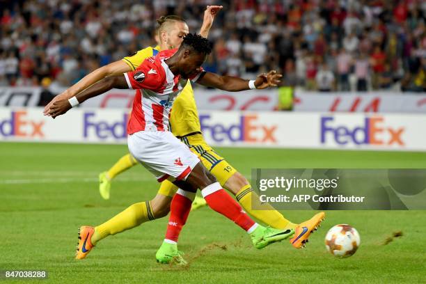 Crvena Zvezda's forward Richmond Boakye vies with Bate's defender Nemanja Milunovic during the UEFA Europa League match between FK Crvena Zvezda...