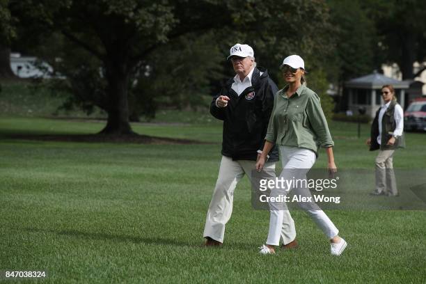 President Donald Trump and first lady Melania Trump walk towards the residence after they returned to the White House from Florida September 14, 2017...