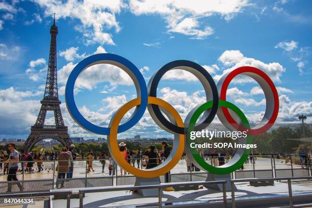 The Olympic Rings being placed in front of the Eiffel Tower in celebration of the French capital won the hosting right for the 2024 summer Olympic...