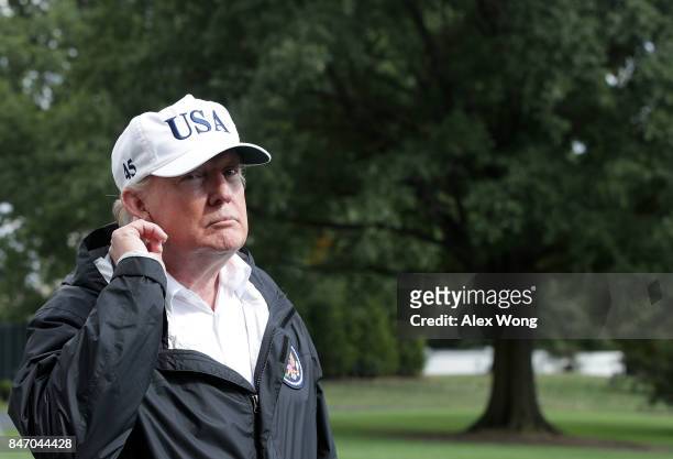 President Donald Trump listens to a question from a member of the media after he returned to the White House from Florida September 14, 2017 in...