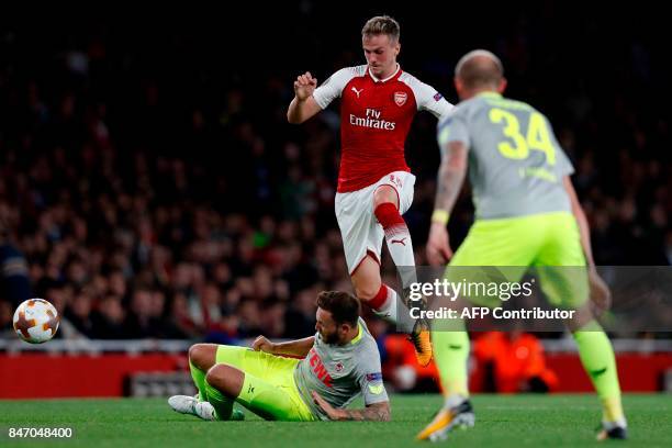 Arsenal's English defender Rob Holding vies with FC Cologne's German midfielder Marco Hoger during the UEFA Europa League Group H football match...